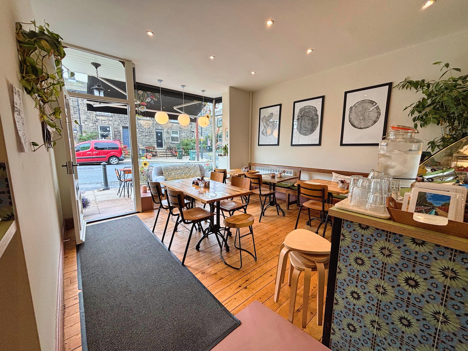 The warm interior of The Coffee Tree looking toward the open front door
